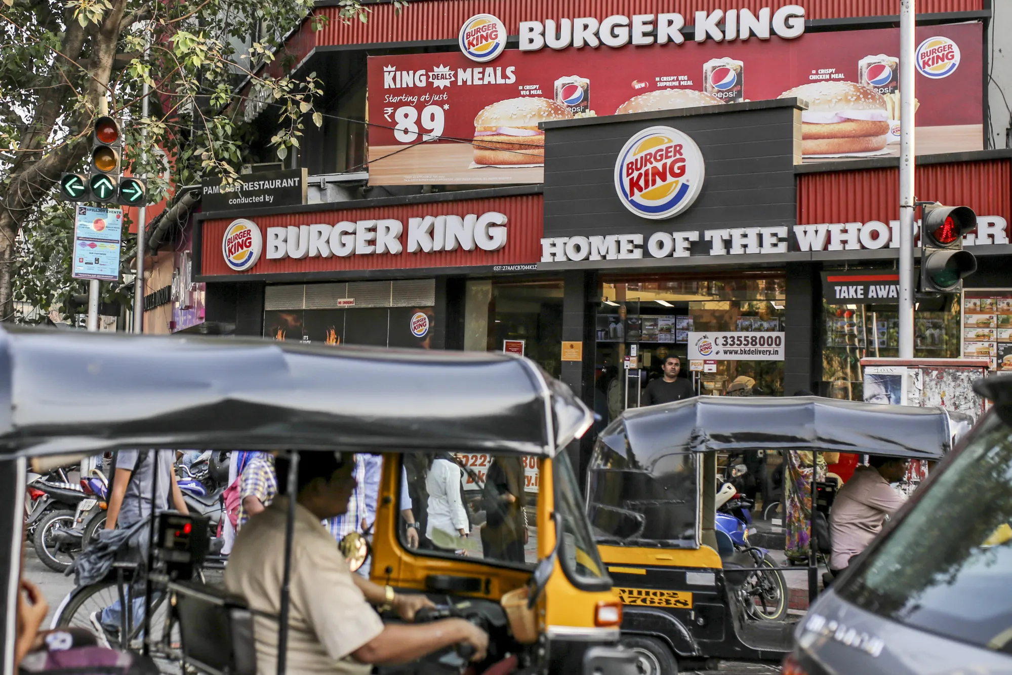Commuters outside a Burger King restaurant n Mumbai.