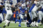 Indianapolis Colts running back Jonathan Taylor (28) carries the ball up field during the second half of an NFL football game against the Las Vegas Raiders, Sunday, Jan. 2, 2022, in Indianapolis. (AP Photo/AJ Mast)