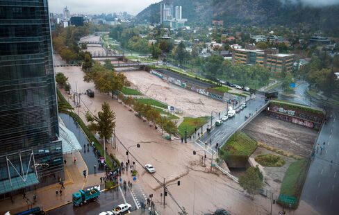 Mapocho river overflows during heavy rains in Santiago on Sunday.