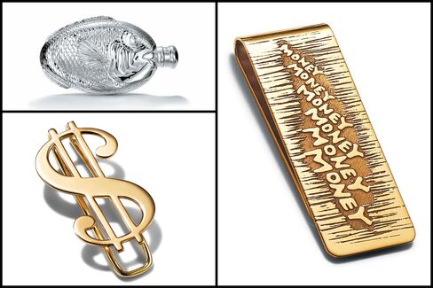 From top left, clockwise: Fish flask in sterling silver, price upon request; "Money" money clip in 18-karat gold, $2,900; "$" money clip in 18-karat gold, $2,900.