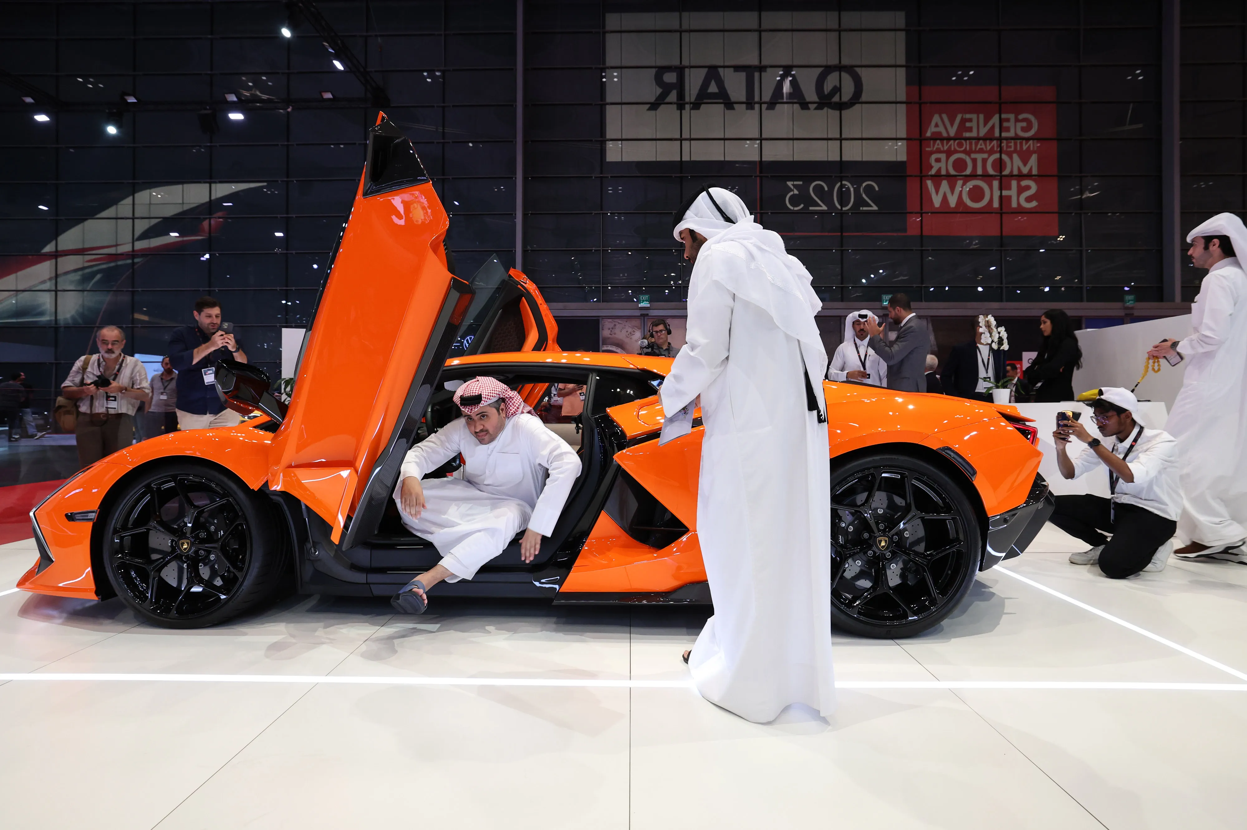 Attendees inspect a Lamborghini Revuelto on the opening day of the Geneva International Motor Show Qatar 2023.
