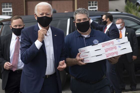 Biden Offers Quip to a Heckler, Pizza to Allies: Campaign Update