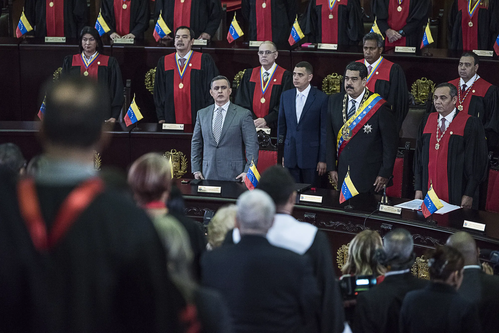Nicolas Maduro, Venezuela's president, front row second right, stands&nbsp;during a judiciary event before the Supreme Court in Caracas on&nbsp;Feb. 14, 2018.
