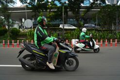 A Gojek delivery driver.