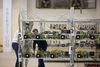 Employees check power supply units and cooling fans linked to cryptocurrency mining machines at the SberBit mining 'hotel.’