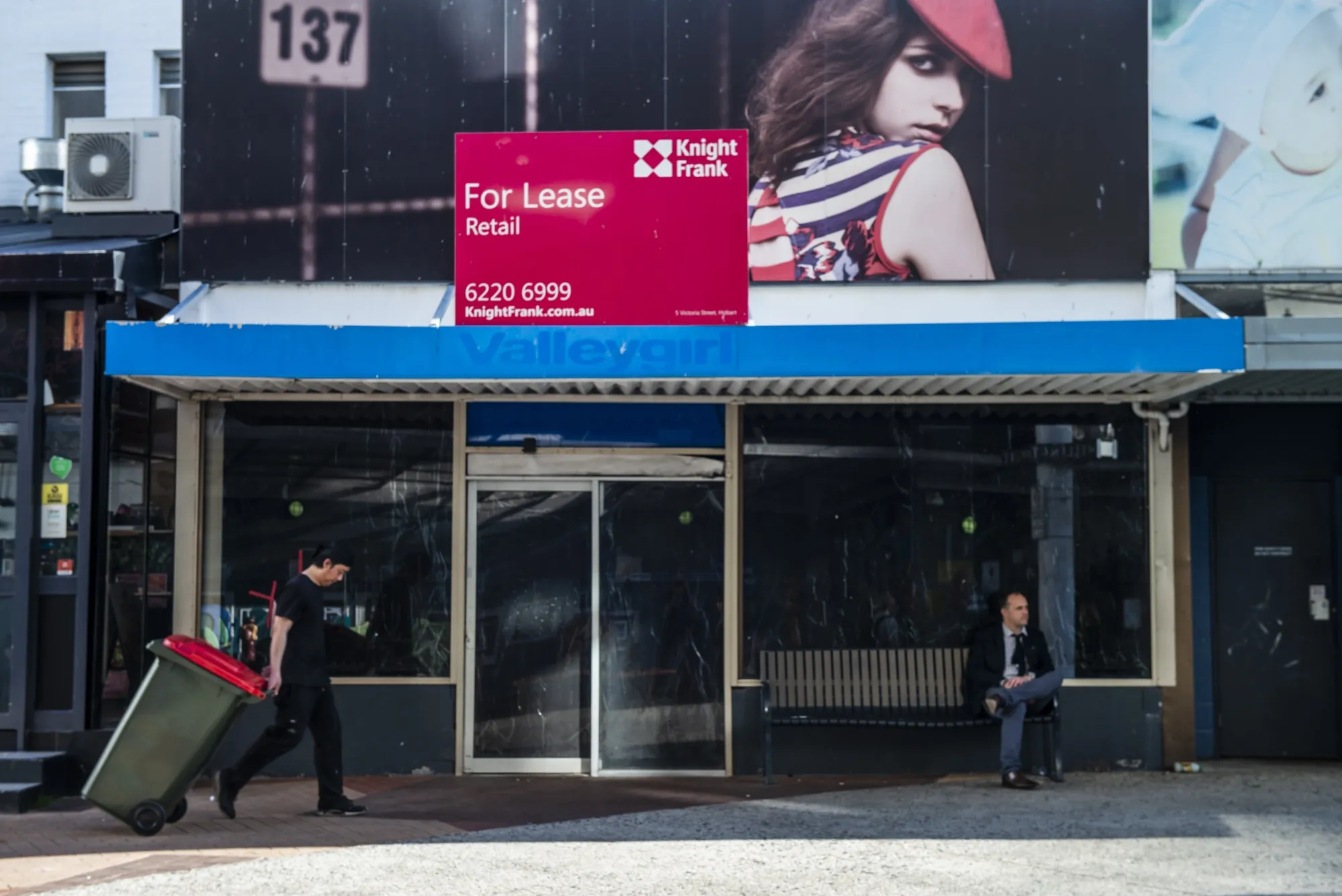 A For Lease sign is displayed above a retail store in Hobart, Tasmania, Australia, on Sept. 21.