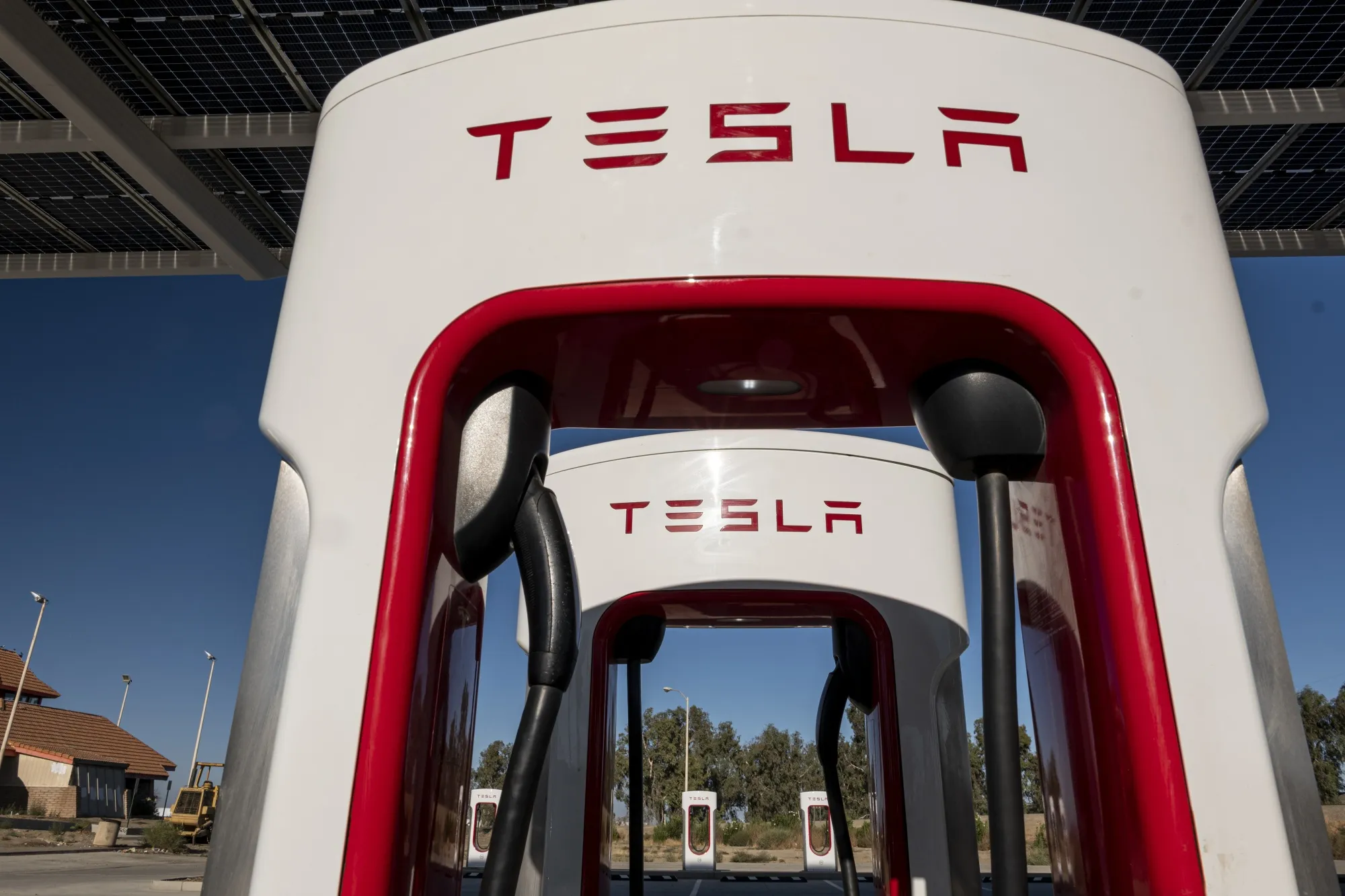 Tesla Vehicles And Charging Stations Ahead Of Earnings Figures