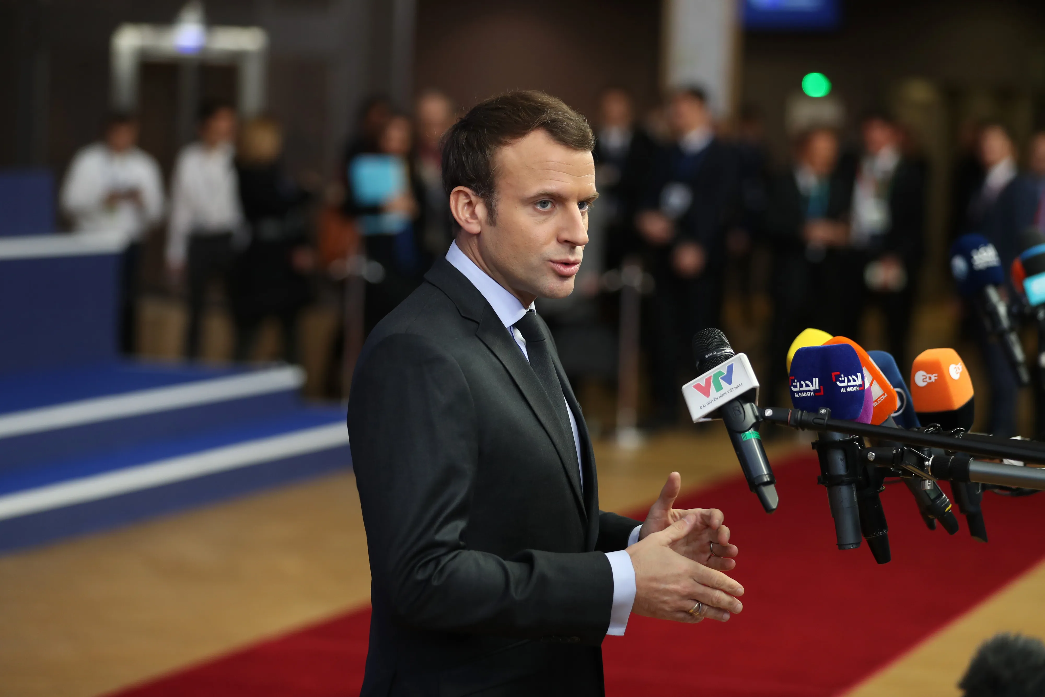 Emmanuel Macron, France's president, speaks to journalists as he arrives at a European Union (EU) leaders summit at the Europa Building in Brussels, Belgium, on Thursday, Dec. 14, 2017.