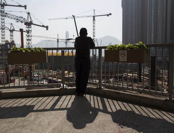 relates to Chinese Developers Surge in Hong Kong as Evergrande Hits Record
