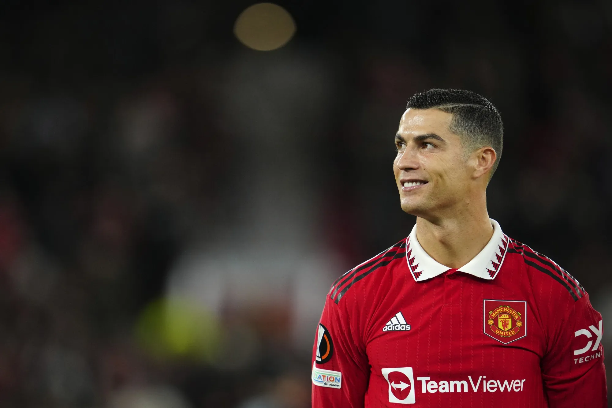 Manchester United's Cristiano Ronaldo smiles before the start of the Europa League group E soccer match between Manchester United and Sheriff at Old Trafford in Manchester, England, Thursday Oct. 27, 2022. (AP Photo/Jon Super)