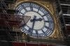 A worker stands on a scaffolding platform near a clock face on the Elizabeth Tower, also known as Big Ben, at the Houses of Parliament in London, U.K., on Thursday, April 4, 2019. Theresa May's government holds intensive talks with Jeremy Corbyn's opposition Labour Party in search of a compromise position on the U.K.’s future ties to the EU.