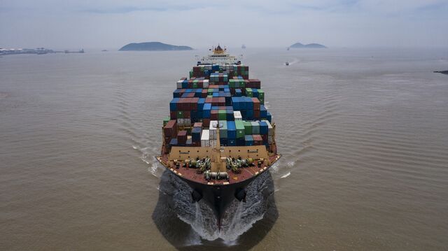 The <em>Kota Cepat</em> vessel loaded with shipping containers approaches the Yangshan Deepwater Port in Shanghai.