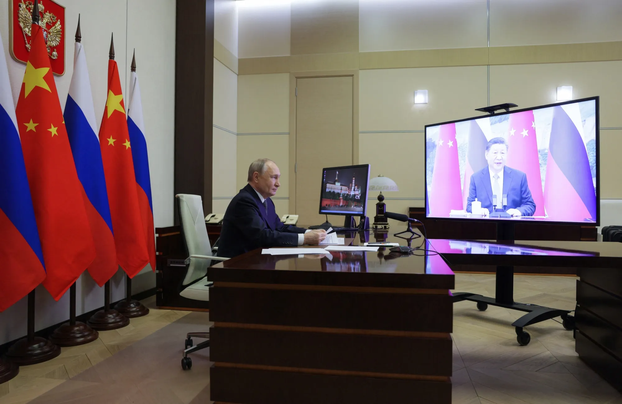 Vladimir Putin speaks with Xi Jinping on Jan. 21, in a photo released by Russian state media.
