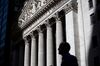 A pedestrian passes in front of the New York Stock Exchange (NYSE) in New York, U.S., on Friday, May 24, 2019. U.S. equities climbed at the end of a bruising week in which escalating trade tensions dominated markets.