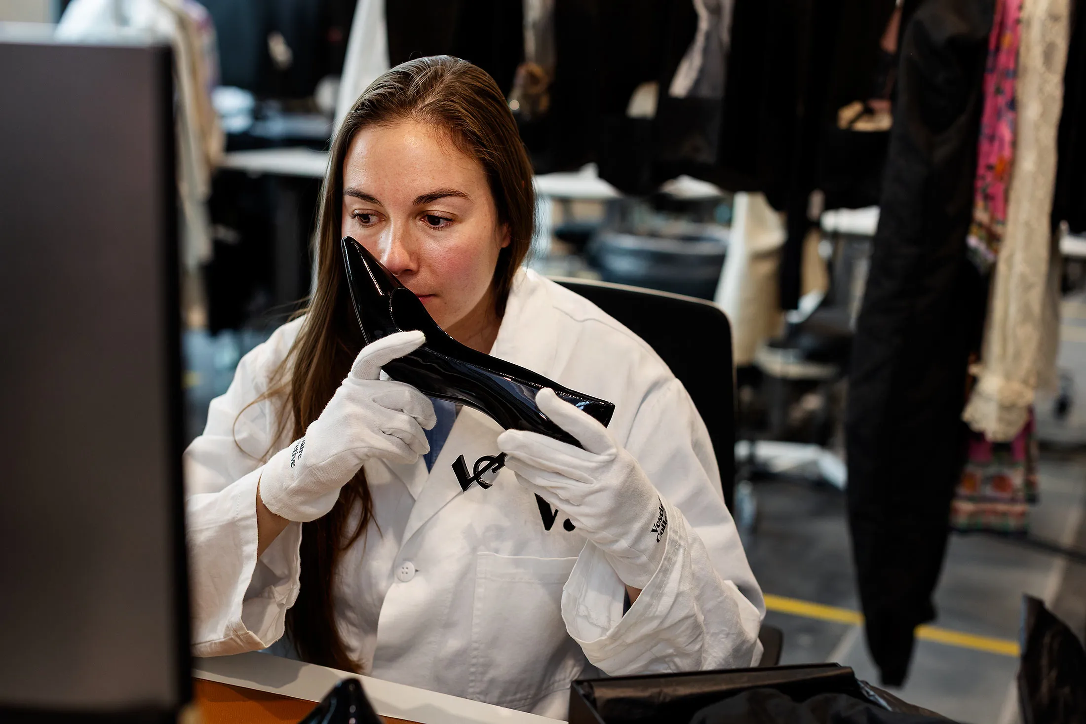 Mélissa B. checks a pair of Saint Laurent shoes.