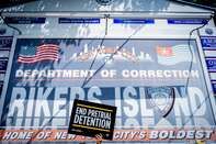 A participant holding a End Pretrial Detention sign at the