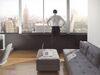 Young man looking out at city skyline
