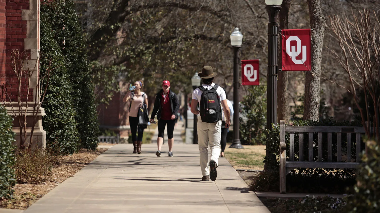 :NORMAN, OK- MARCH 11: Students walk on campus between clases at the University of Oklahoma on March 11, 2015 in Norman, Oklahoma. Video showing Sigma Alpha Epsilon members singing a racist chant while traveling on a tour bus went viral after being uploaded to the internet. SAE's national chapter has since suspended the students involved and the University of Oklahoma President David Boren has terminated the fraternity's affiliation with the school.
