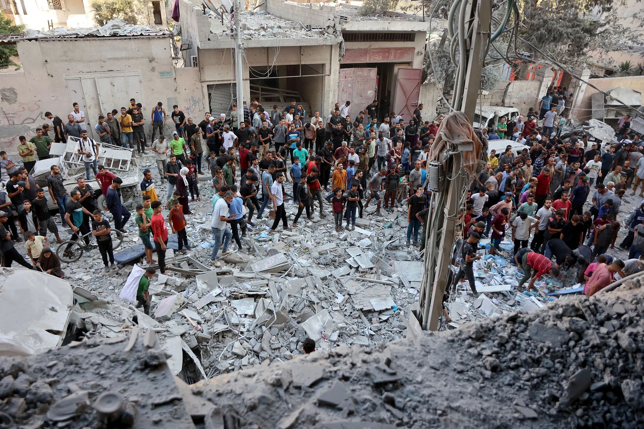 Palestinians gather to look for survivors at the site of an Israeli strike in the Al-Rimal neighborhood of Gaza City on Aug.&nbsp;30.