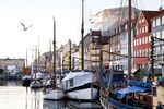 Boats sit moored in the harbour in the Nyhavn district of central Copenhagen, Denmark, on Monday, Nov. 19, 2012. Denmark's two-year yields sank to the lowest in almost three months in Copenhagen trading as Europe's debt crisis continues to drive investors north.