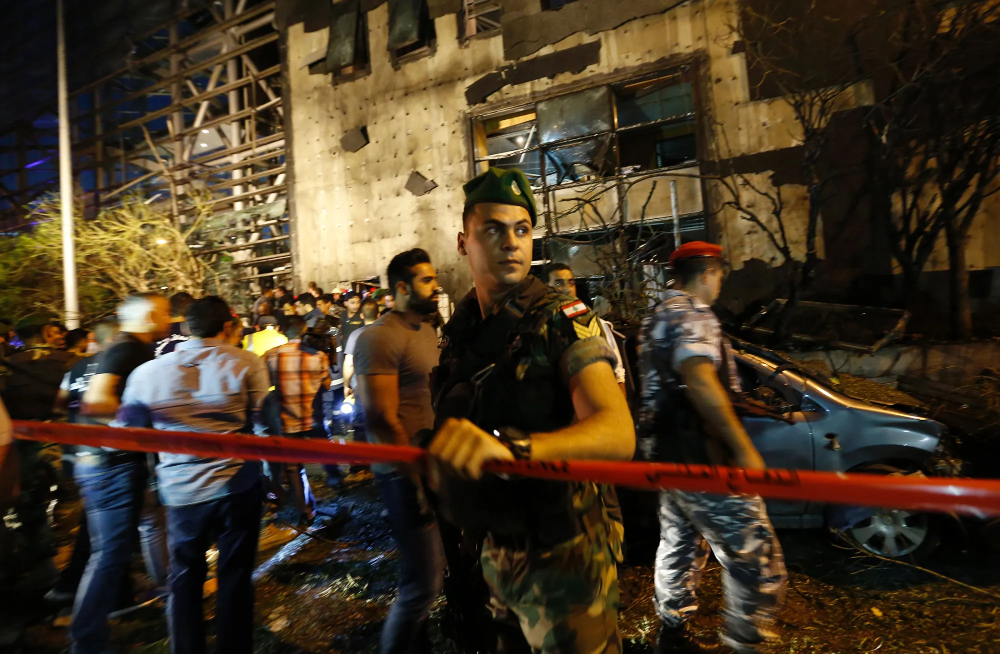 Lebanese security forces cordon off an area covered in debris following an explosion near a major bank in the western part of the Lebanese capital Beirut late on June 12, 2016. An AFP correspondent saw almost all the entire glass facade of a branch of the BLOM BANK, one of the country's largest, blown out, with debris littering the ground. / AFP / ANWAR AMRO (Photo credit should read ANWAR AMRO/AFP/Getty Images)
