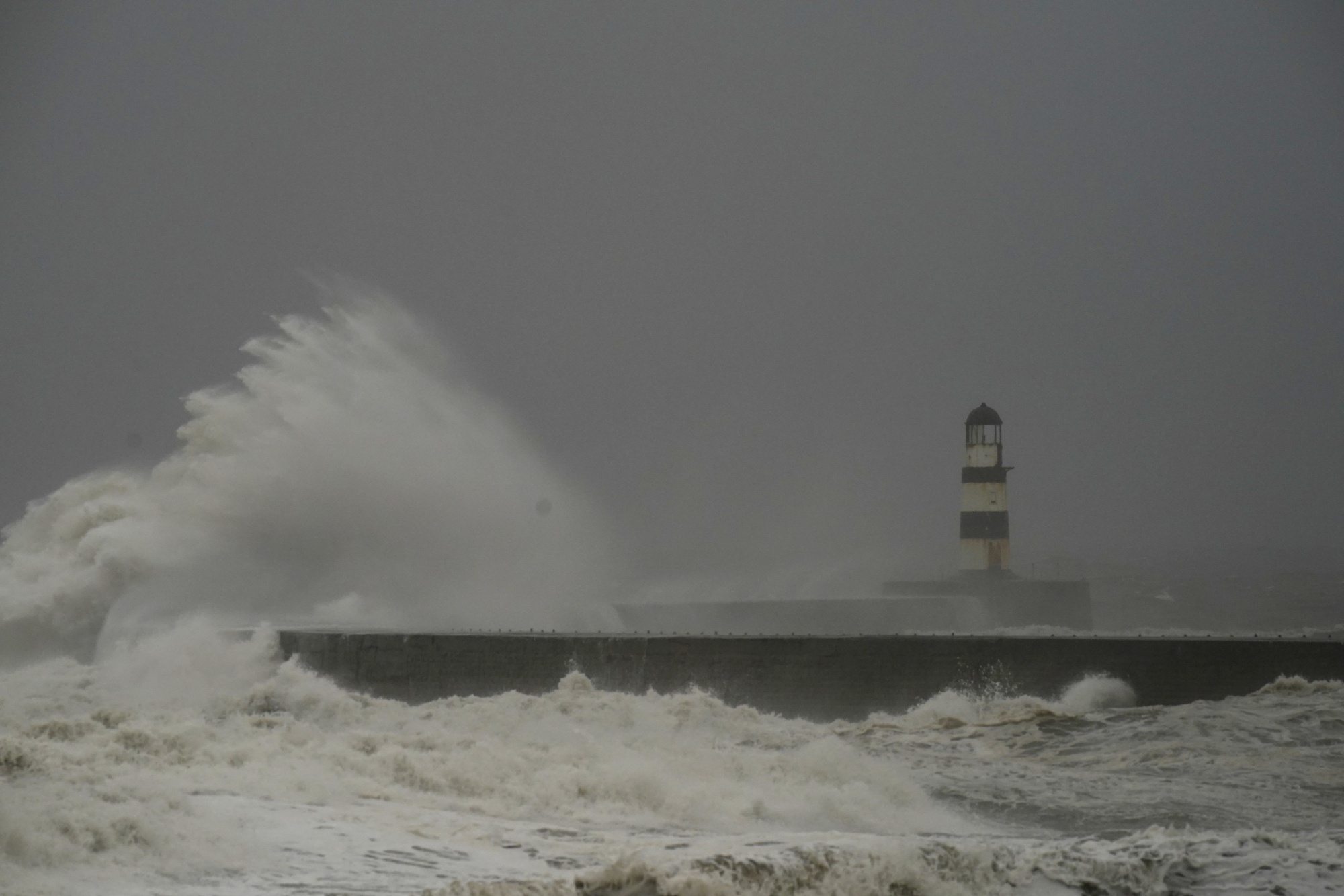 Waves crash against the lighthouse in Seaham Harbour, County Durham, on Nov. 17.