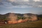 Logging trucks carrying Okoume wood leave the Ovindo national park near Makokou, Gabon.