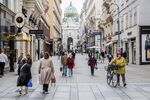Pedestrians walk down the Kohlmarkt shopping street in Vienna, Austria.