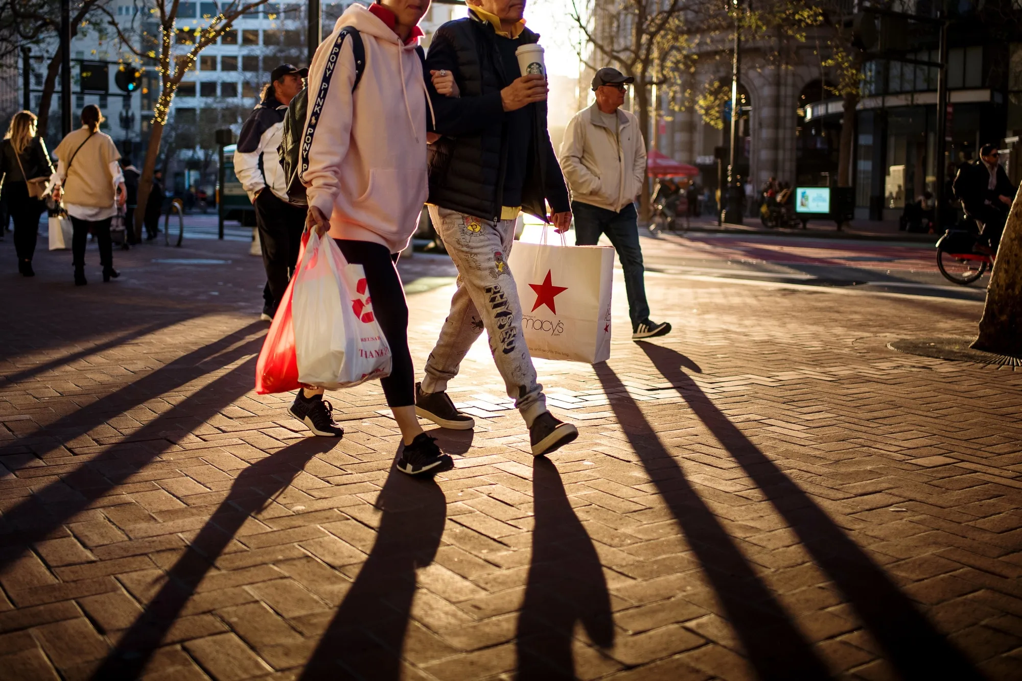 Pedestrians carry shopping bags in San Francisco, California.