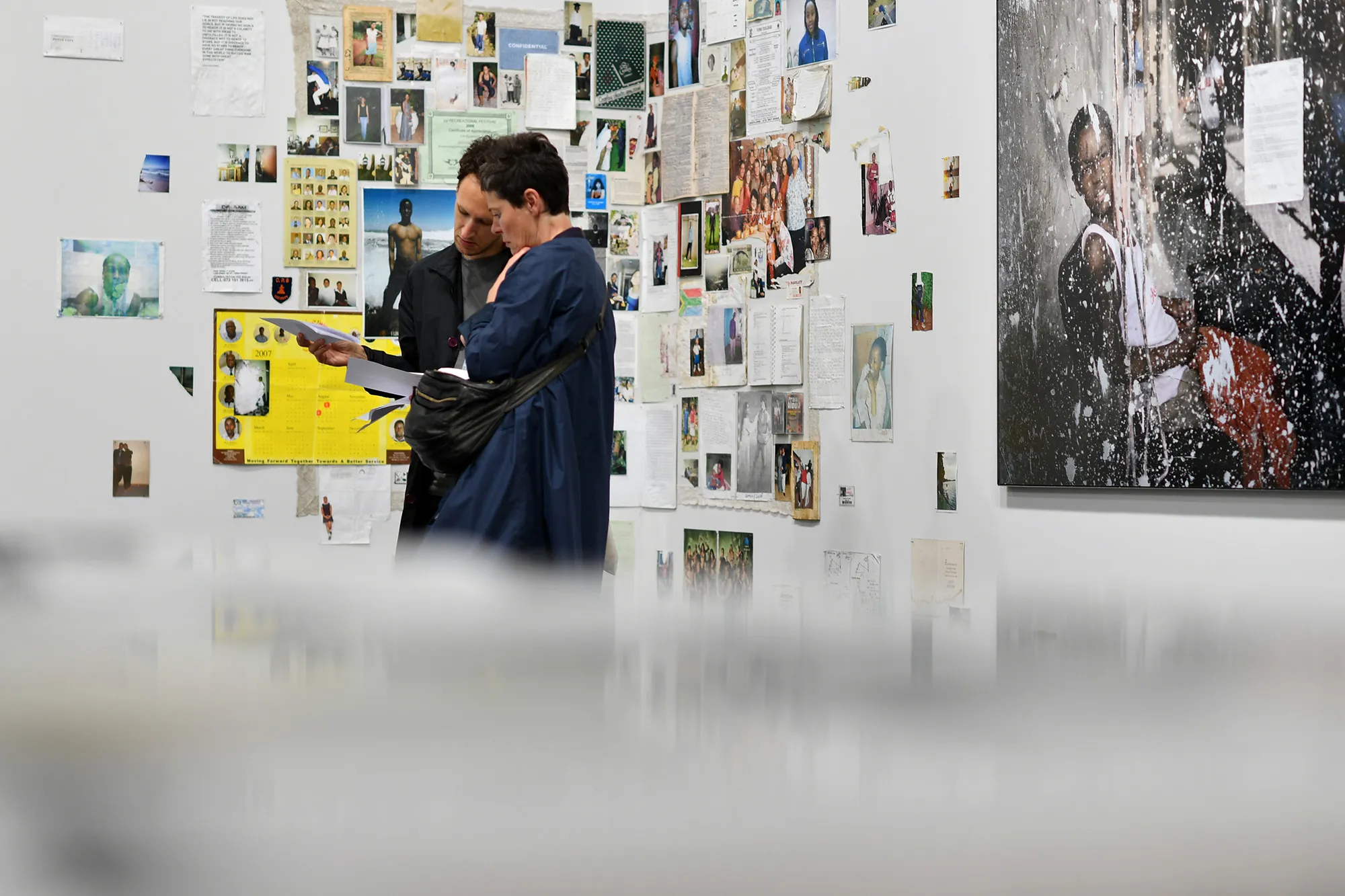 Visitors look at the artwork of Mikhael Subotzky and Patrick Waterhouse "Ponte City" during Art&nbsp;&nbsp;Basel 2018.&nbsp;