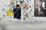 Visitors look at the artwork of Mikhael Subotzky and Patrick Waterhouse &quot;Ponte City&quot; during Art&nbsp;&nbsp;Basel 2018.&nbsp;