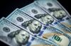 U.S. one-hundred dollar banknotes are arranged for a photograph in Hong Kong, China, on Monday, April 15, 2019. China's holdings of Treasury securities rose for a third month as the Asian nation took on more U.S. government debt amid the trade war between the world’s two biggest economies.