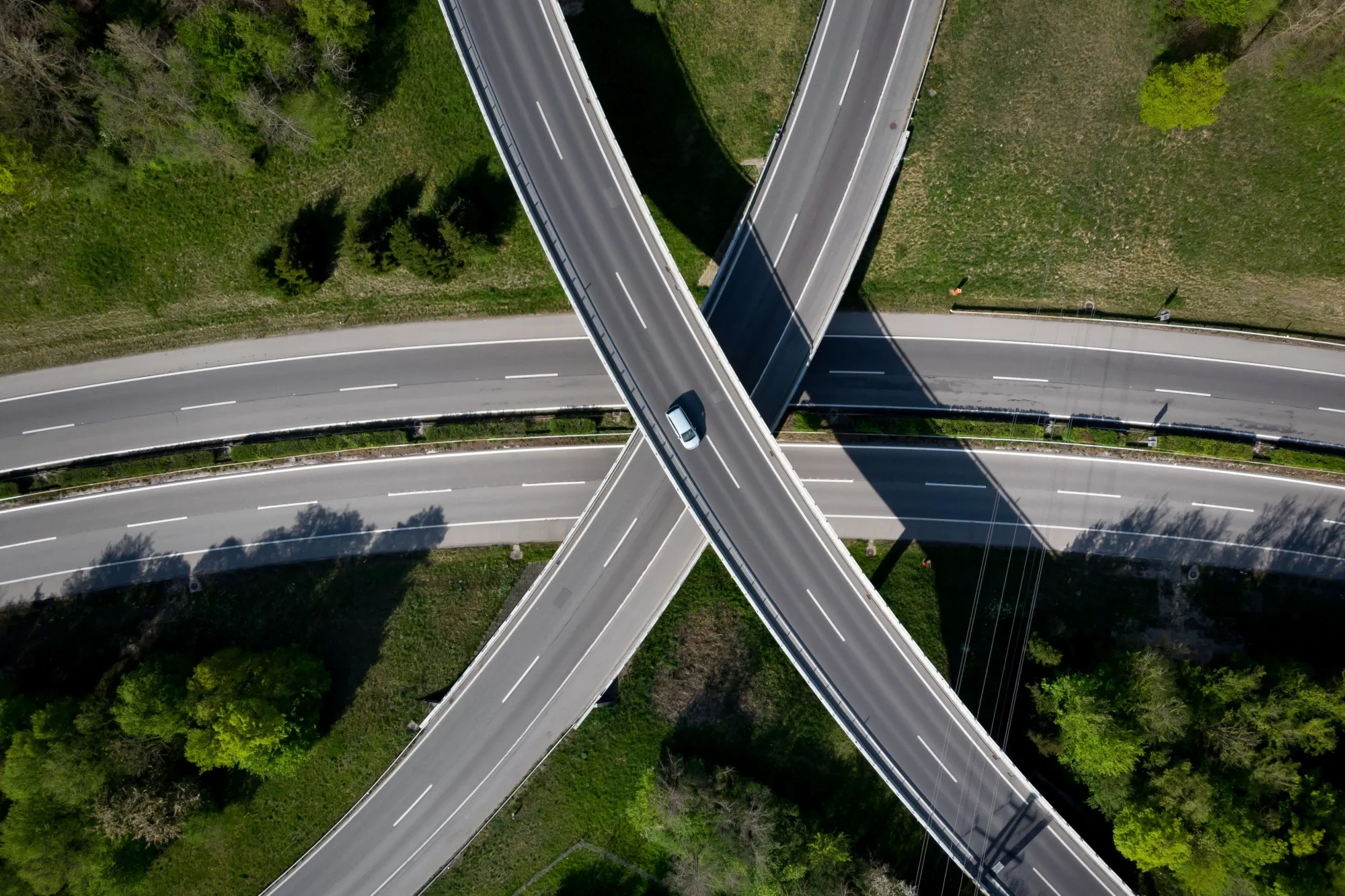 A&nbsp;car crosses an&nbsp;empty interchange in Ecublens, Switzerland, on April 12.