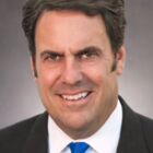 Headshot of Mark L Reuss