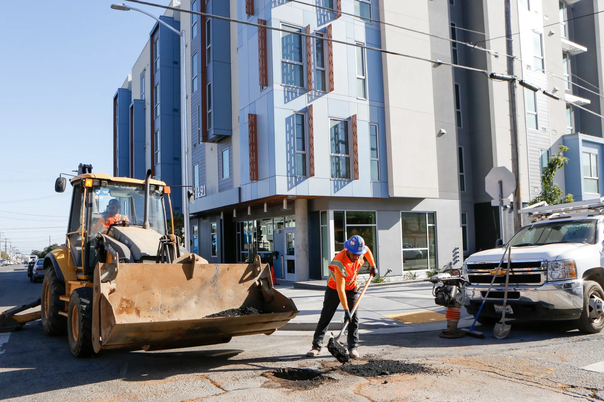 A contractor fills a hole in the street outside a housing redevelopment project completed in 2019 in San Francisco,&nbsp;where the median rent is $3,650 and the median&nbsp;home sells for more than $1.2&nbsp;million, according to Zillow.