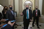 Mark Meadows, White House chief of staff, center, and Steven Mnuchin, U.S. Treasury secretary, second left, speak to members of the media as they arrive for a meeting at the U.S. Capitol in Washington, D.C., on Aug. 1.