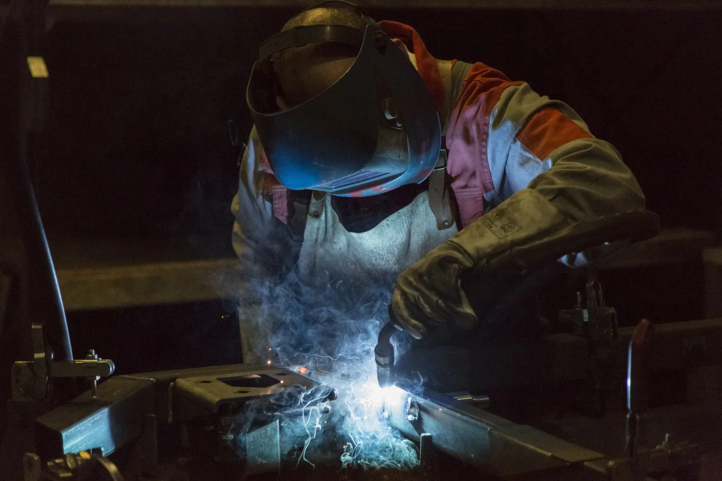 An employee welds at a factory in Laupheim, Germany.