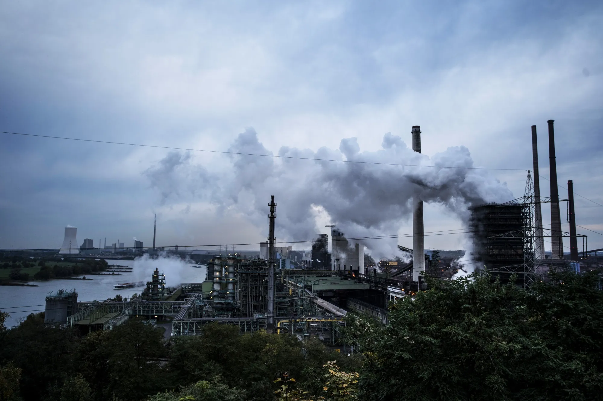 Emissions rise from a steel plant on the River Rhine in Duisburg.