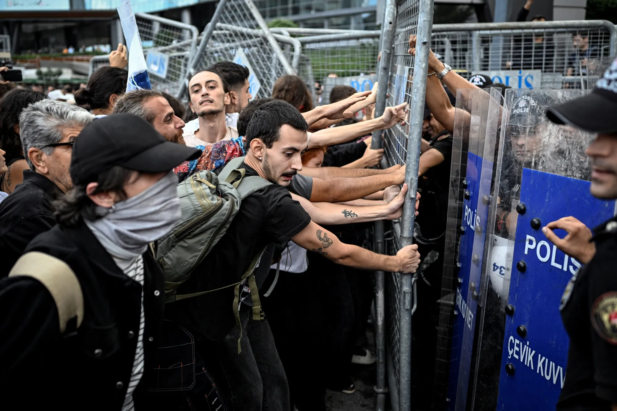 Protesters face riot police near the headquarters of Turkey’s main opposition party in Istanbul, on Sept. 8.