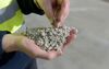 An employee holds processed lithium for a photograph at a Talison Lithium Ltd. facility, a joint venture between Tianqi Lithium Corp. and Albemarle Corp., in Greenbushes, Australia, on Thursday, Aug. 3, 2017. Rising Chinese demand for lithium-ion batteries needed for electric vehicles and energy storage is driving significant price gains and an asset boom in Australia, already the world\'s largest lithium producer.