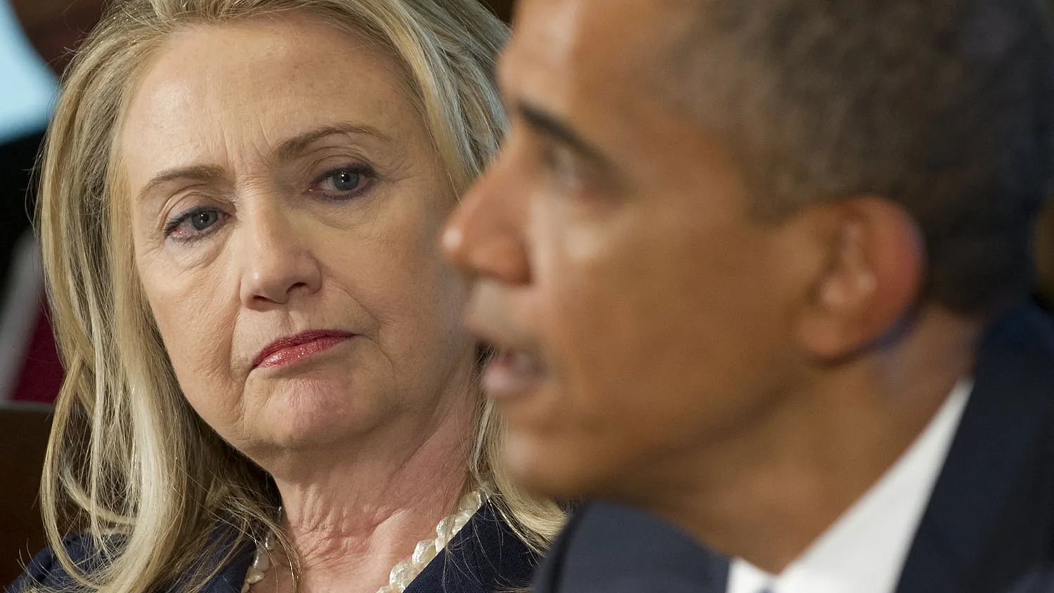 US President Barack Obama speaks alongside US Secretary of State Hillary Clinton as he holds a Cabinet Meeting in the Cabinet Room of the White House in Washington, DC, July 26, 2012.
