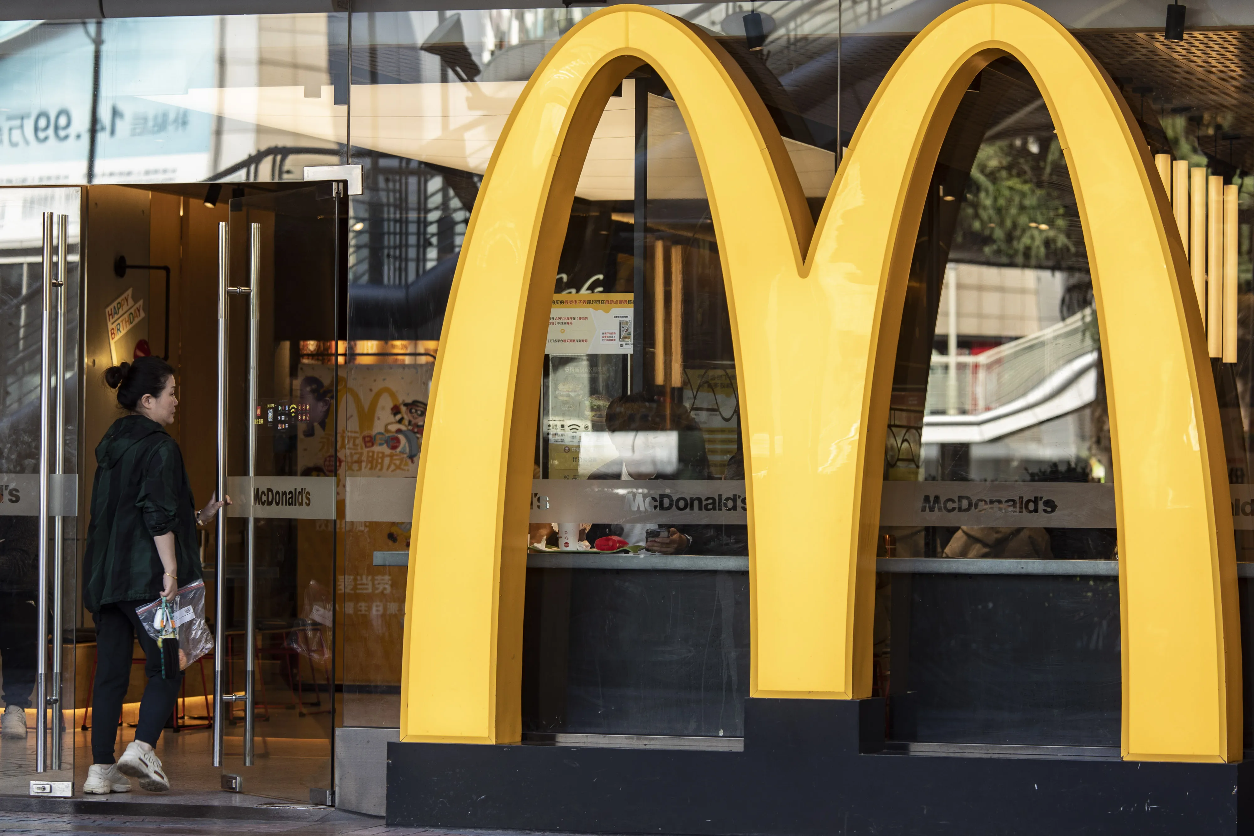 A customer enters a McDonald's&nbsp;restaurant in Shanghai.