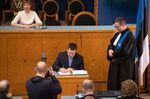 Kersti Kaljulaid&nbsp; looks on as Juri Ratas takes&nbsp;the oath during the Estonian parliament Riigikogu's opening sitting after elections.&nbsp;