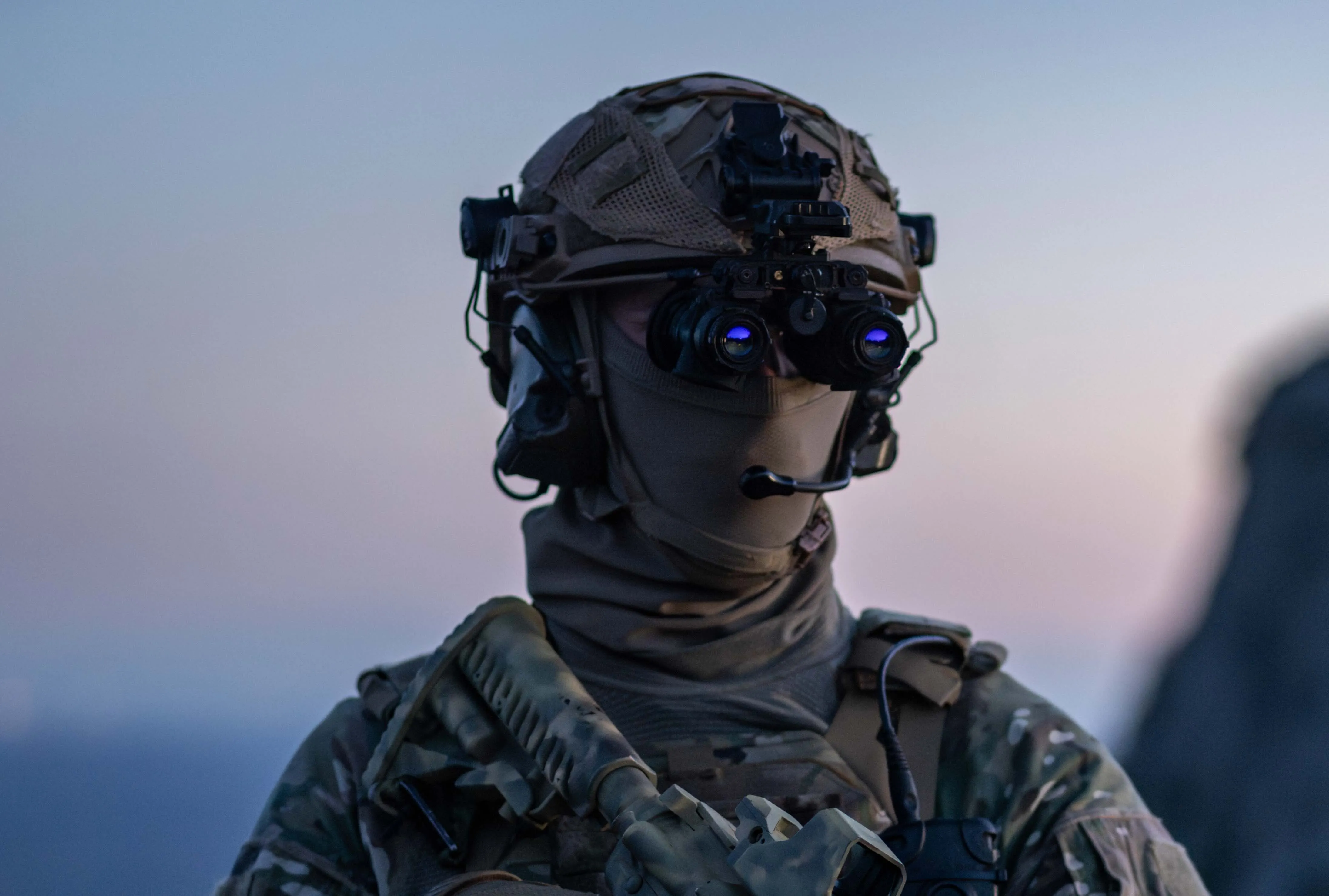 Special forces wearing binoculars mounted on helmets, equipped with Exosens fifth generation 5G image intensifier tubes.