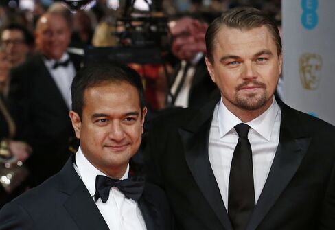 Riza Aziz, left, and Leonardo DiCaprio, who isn’t accused of wrongdoing, in London on Feb. 16, 2014.