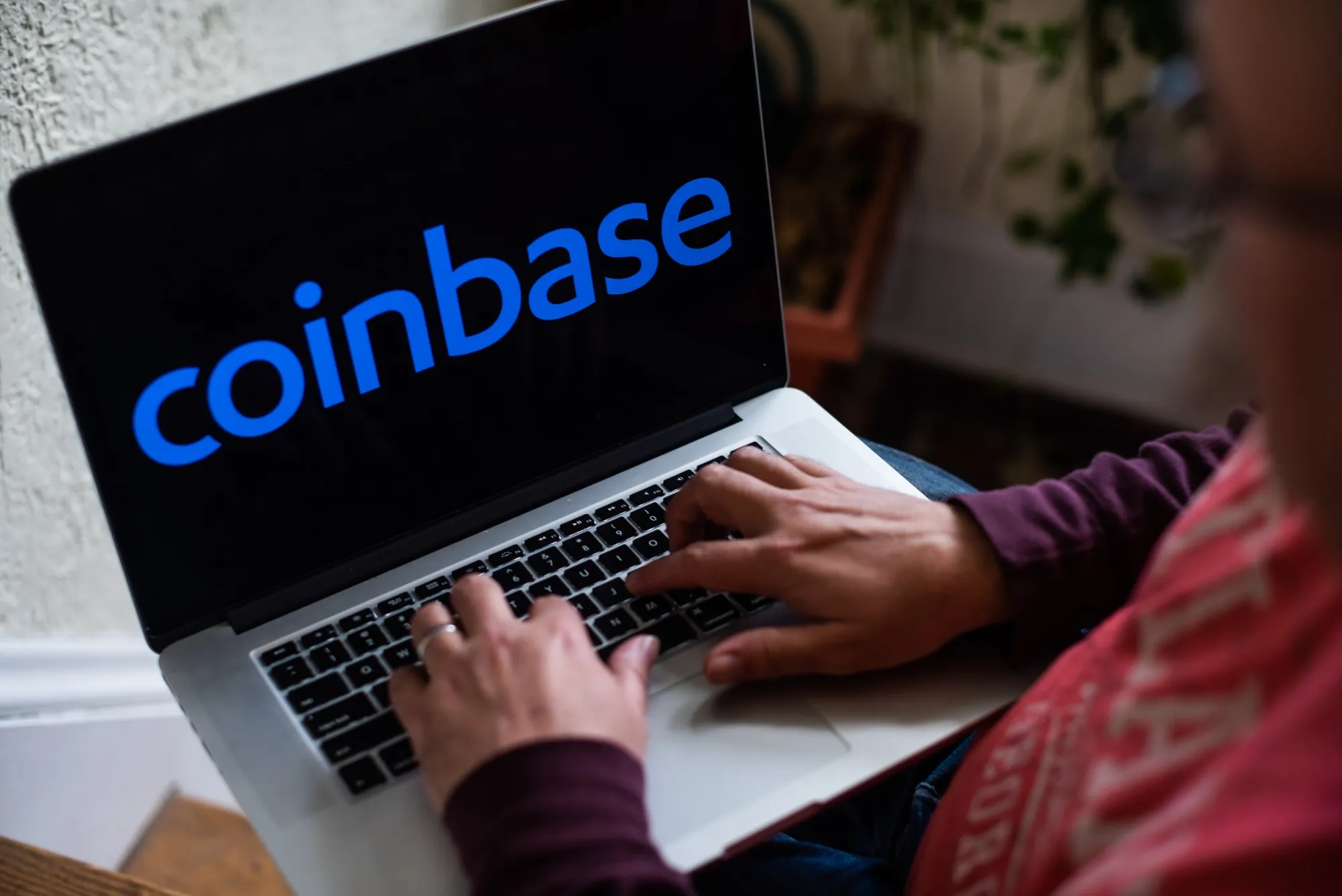 The Coinbase logo on a laptop computer.