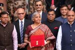Nirmala Sitharaman, India's finance minister, center, and other members of the finance ministry pose for a photography on Feb. 1.
