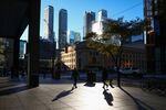 Pedestrians in the financial district of Toronto, Ontario, Canada, on Wednesday, Oct. 29, 2025. Prime Minister Mark Carney's government has pledged to take steps to improve infrastructure, housing, the military and business competitiveness in next week's budget.