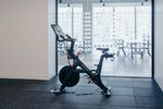 A Peloton Cycle Inc. bicycle stands in the gym area of the Dwight Capital LLC new office space inside 787 11th Avenue in New York, U.S., on Monday, July 30, 2018. 