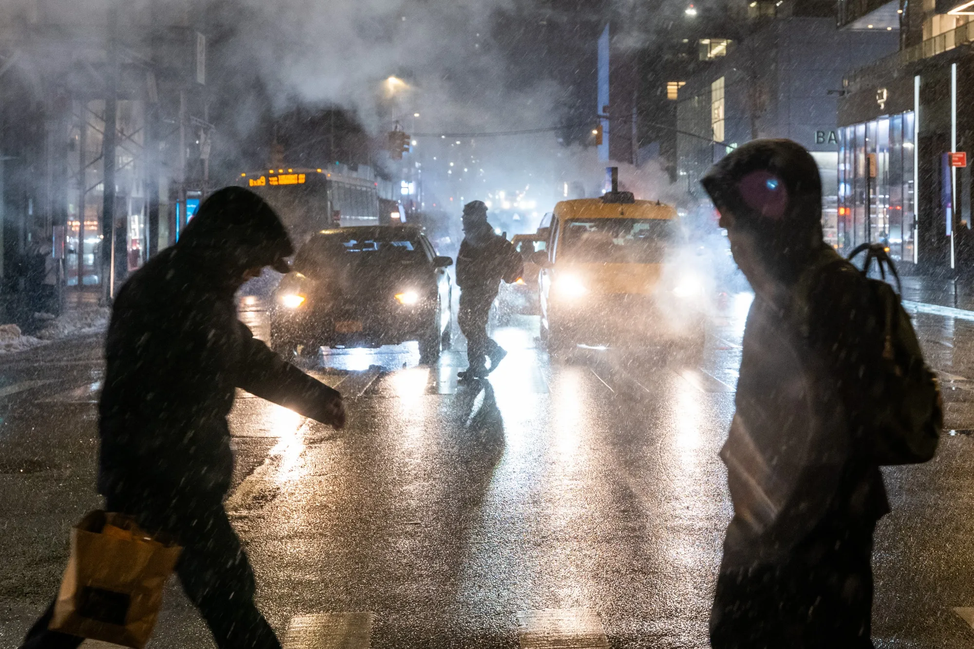 People walk through Manhattan in February 2025.